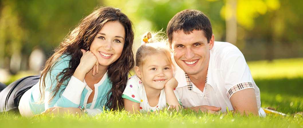Family smiling with smiling with white teeth